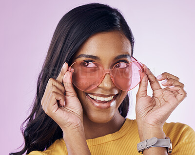 Buy stock photo Glasses, sunglasses and cool woman excited, happy and confident isolated in a pink studio background with joy. Vision, thinking and young gen z female with stylish frames with a positive energy