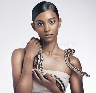 Buy stock photo Beauty, portrait and woman in studio with snake on neck for art aesthetic with exotic zoo animal on white background. Face, skin and creative style, asian fashion model holding dangerous pet python