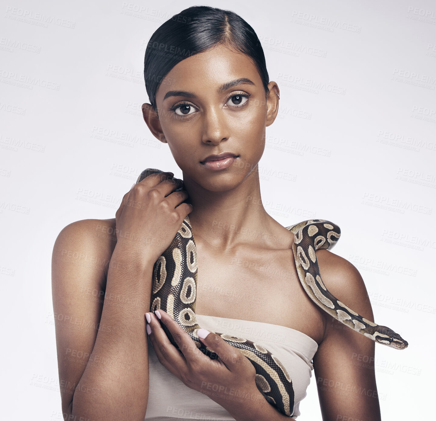 Buy stock photo Beauty, portrait and woman in studio with snake on neck for art aesthetic with exotic zoo animal on white background. Face, skin and creative style, asian fashion model holding dangerous pet python