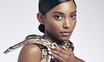 Beauty, nature and portrait of woman with snake on neck for art aesthetic with exotic zoo animal on white background. Face, danger and creative style, asian model with dangerous pet python in studio.