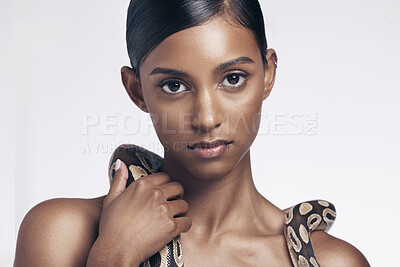 Buy stock photo Beauty, skincare and portrait of woman with snake on neck in studio for art aesthetic with exotic zoo animal. Face, danger and creative style, asian model dangerous pet python on white background.