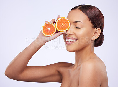 Buy stock photo Skincare, orange and woman in studio for vitamin c, treatment and cosmetics on purple background. Smile, fruit and girl model relax with diy facial, organic and skin, beauty and citrus cleaning