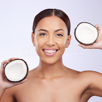 Buy stock photo Woman, coconut and studio portrait with smile for self care, skincare or beauty with natural benefits for face. Girl, model and fruit for skin wellness, cosmetic health and dermatology by background