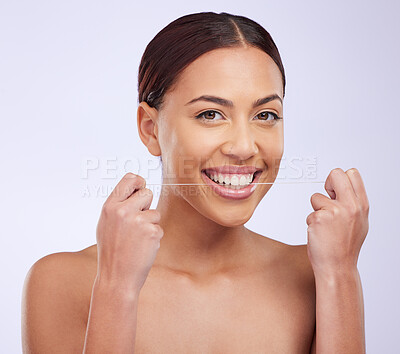 Buy stock photo Portrait, happy and woman flossing teeth on studio background for healthy dental wellness. Female model, oral thread and cleaning mouth of fresh breath, tooth maintenance and care of smile for beauty