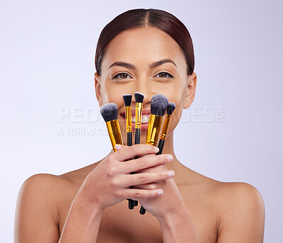 Buy stock photo Makeup, smile or portrait of woman with brushes in studio with facial cosmetics or skincare tools. Beauty, face grooming application or happy girl model isolated on white background with mockup 