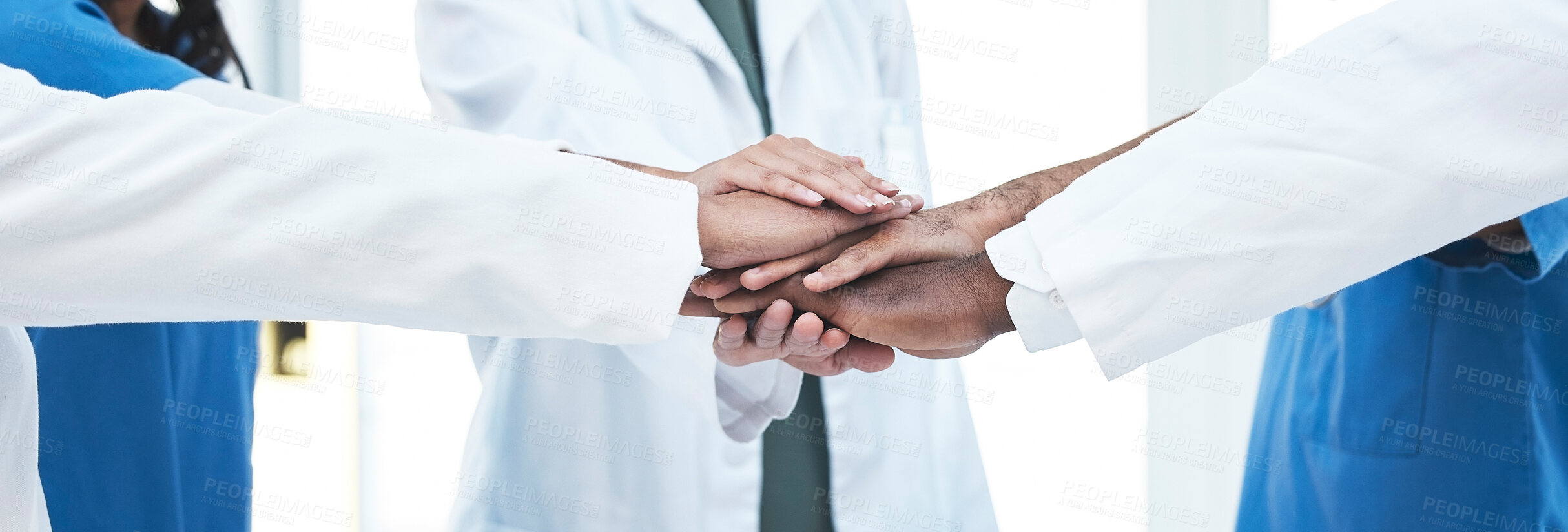 Buy stock photo Hand stack, group and doctors with teamwork, motivation and support for healthcare services at clinic. Men, women and medic team building with hands, solidarity and together at hospital for wellness