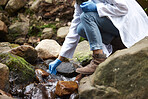 Science, river and woman with test tube for water for environment inspection, check and sample. Sustainability, agriculture and hands of female scientist in forest for analysis, research and study