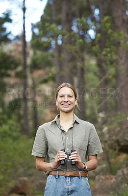 Buy stock photo Binocular, nature and portrait of happy woman hiking in forest journey, jungle adventure and travel or outdoor explore. Face of a young person birdwatching and trekking in eco friendly, green woods
