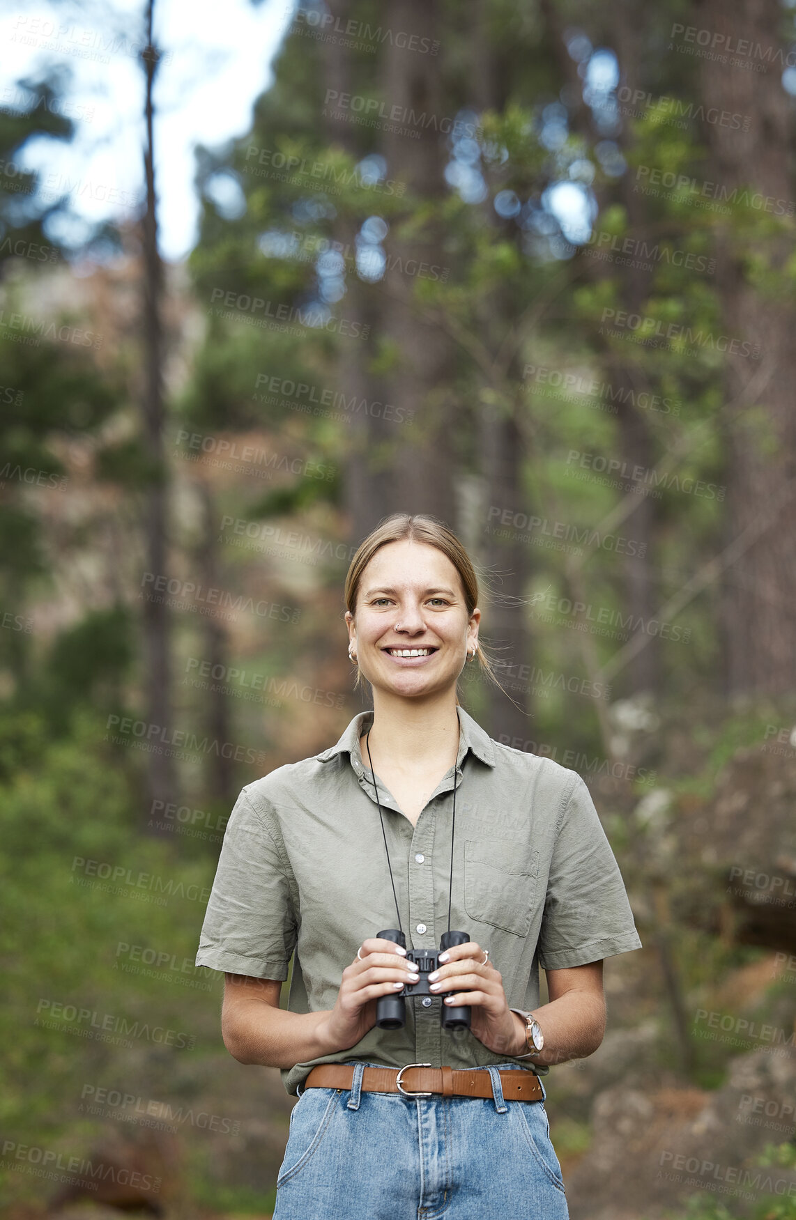 Buy stock photo Binocular, nature and portrait of happy woman hiking in forest journey, jungle adventure and travel or outdoor explore. Face of a young person birdwatching and trekking in eco friendly, green woods