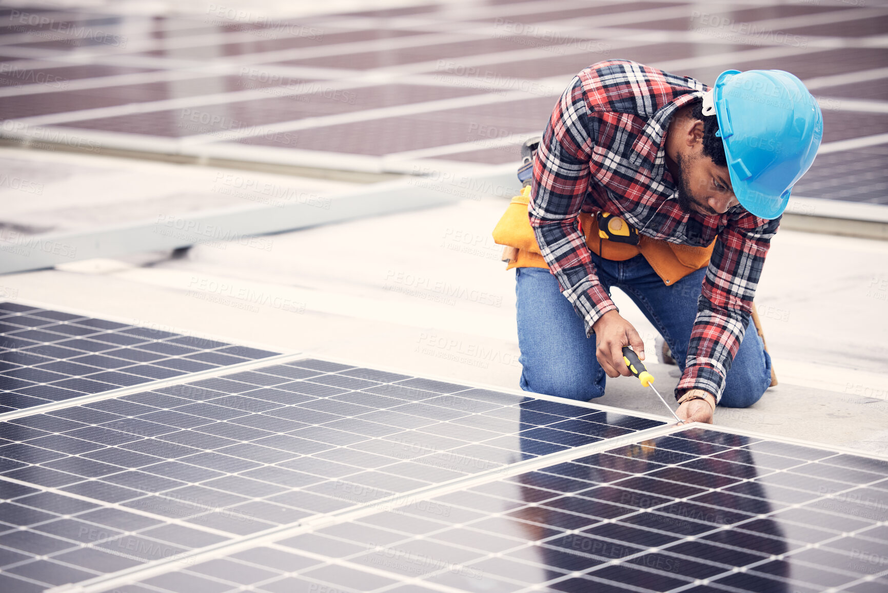 Buy stock photo Black man, electrician and solar panels installation on rooftop, sustainable energy with eco friendly technology. Maintenance, tools and male in engineering with infrastructure and power from the sun