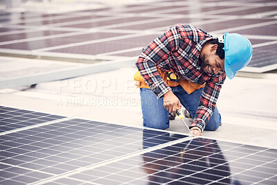 Buy stock photo Solar panel, repair and engineering man on rooftop with tools, energy saving and sustainable power maintenance. African person, electrician contractor or technician working on photovoltaic generator