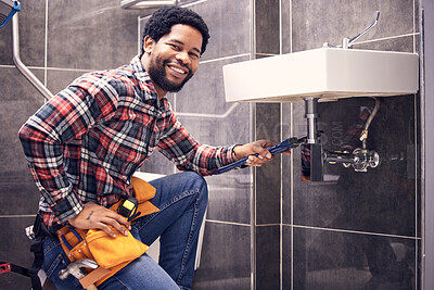 Buy stock photo Portrait, man and plumber with smile, maintenance and installation with home repairs. Face, Nigerian male employee or worker with tools, fixing pipes and sink with handyman, contractor and renovation
