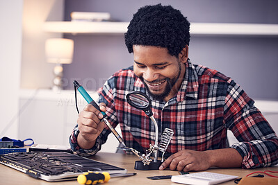 Buy stock photo Black man, technician and fixing computer circuit board in hardware, soldering iron tools or tech repair. Maintenance, magnifying glass or electrical fix with happy male working on device motherboard