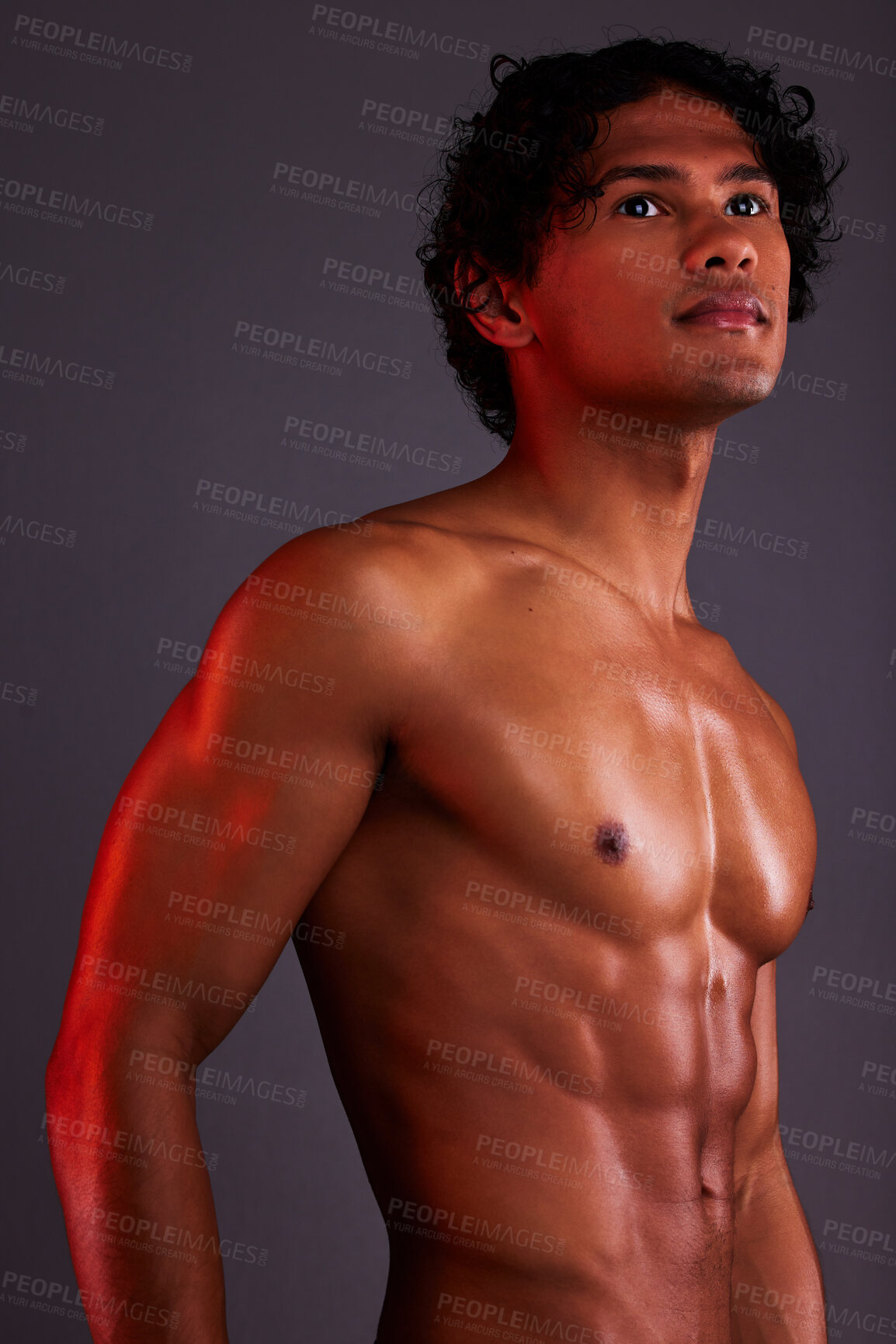 Buy stock photo Light, strong and man chest in a studio with art lighting and thinking with muscles and fitness. Focus, isolated and gray background of an attractive male model with artistic, and shirtless spotlight