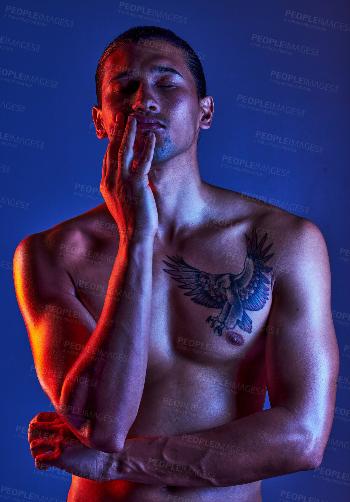 Buy stock photo Sexy, beauty and man in dark light with chest tattoo as body art and model isolated in a studio background closed eyes. Creative, topless and young artistic person with seductive look in a shadow