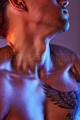 Buy stock photo Man, chest and neon light in studio for art, fitness or beauty of a person on a gray background. Strong body, neck and male model with a tattoo, glow and creative motivation for aesthetic backdrop