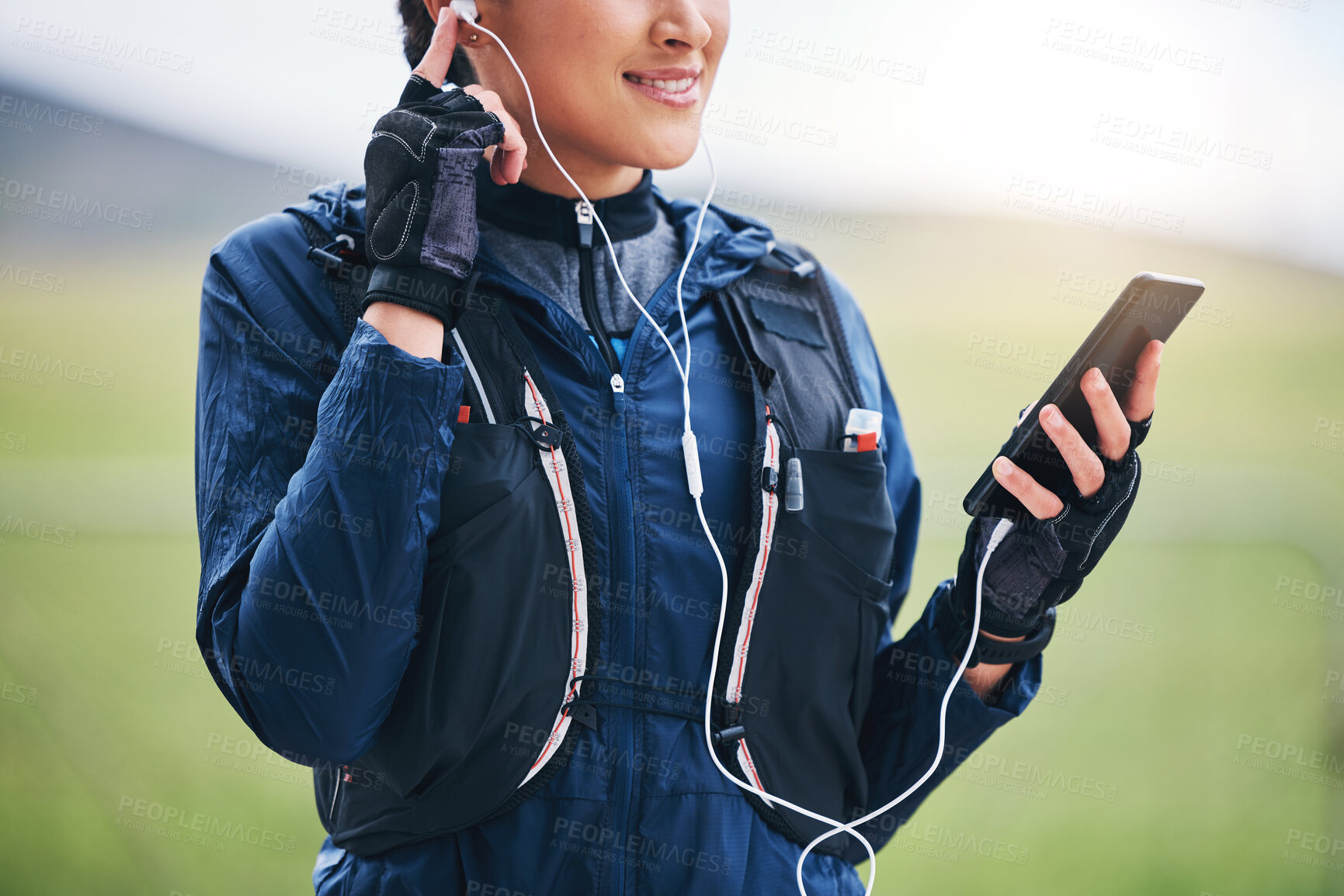 Buy stock photo Music, phone hands and woman in the countryside ready for fitness and exercise with mockup. Sports, run training and mobile headphones of a female athlete with audio and web radio for workout