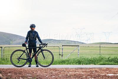 Buy stock photo Woman, athlete and bicycle in countryside, mockup on sky and training for triathlon, sports and goals. Female cyclist, bike and fitness gear with motivation, freedom or thinking of cardio performance