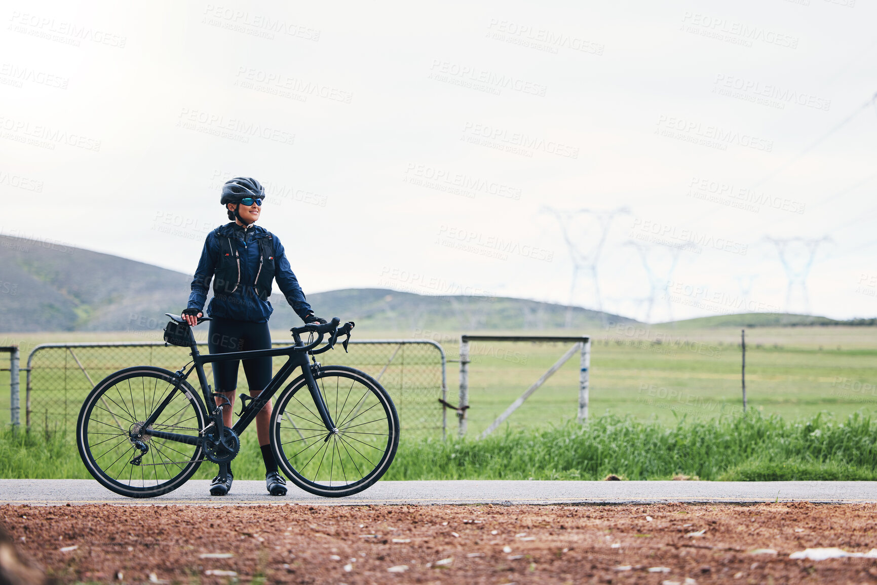 Buy stock photo Woman, athlete and bicycle in countryside, mockup on sky and training for triathlon, sports and goals. Female cyclist, bike and fitness gear with motivation, freedom or thinking of cardio performance