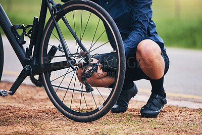 Person, bike and wheel repair outdoor for training, triathlon sports and transportation problem. Closeup of athlete, bicycle and check tire chain for travel safety, cycling maintenance and fixing hub