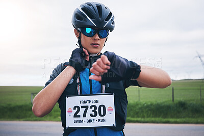 Buy stock photo Woman, cyclist and check heart rate on watch, timer and monitor health progress in triathlon race. Female bicycle athlete, neck pulse and stopwatch for cycling performance, cardio training and sports