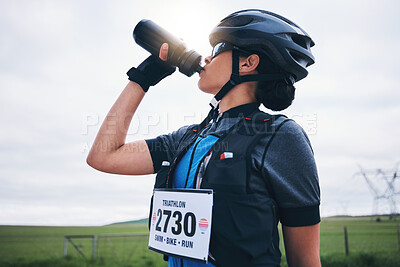 Buy stock photo Fitness, cyclist or woman drinking water in park to hydrate, relax or healthy energy on exercise break. Tired thirsty girl athlete biker refreshing with liquid for hydration in training or workout 