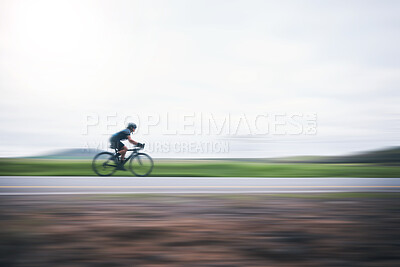 Buy stock photo Person cycling fast with motion blur, sky mockup and bike in countryside, triathlon and cardio training. Athlete, bicycle and marathon race with speed, energy and sports for exercise, power or action