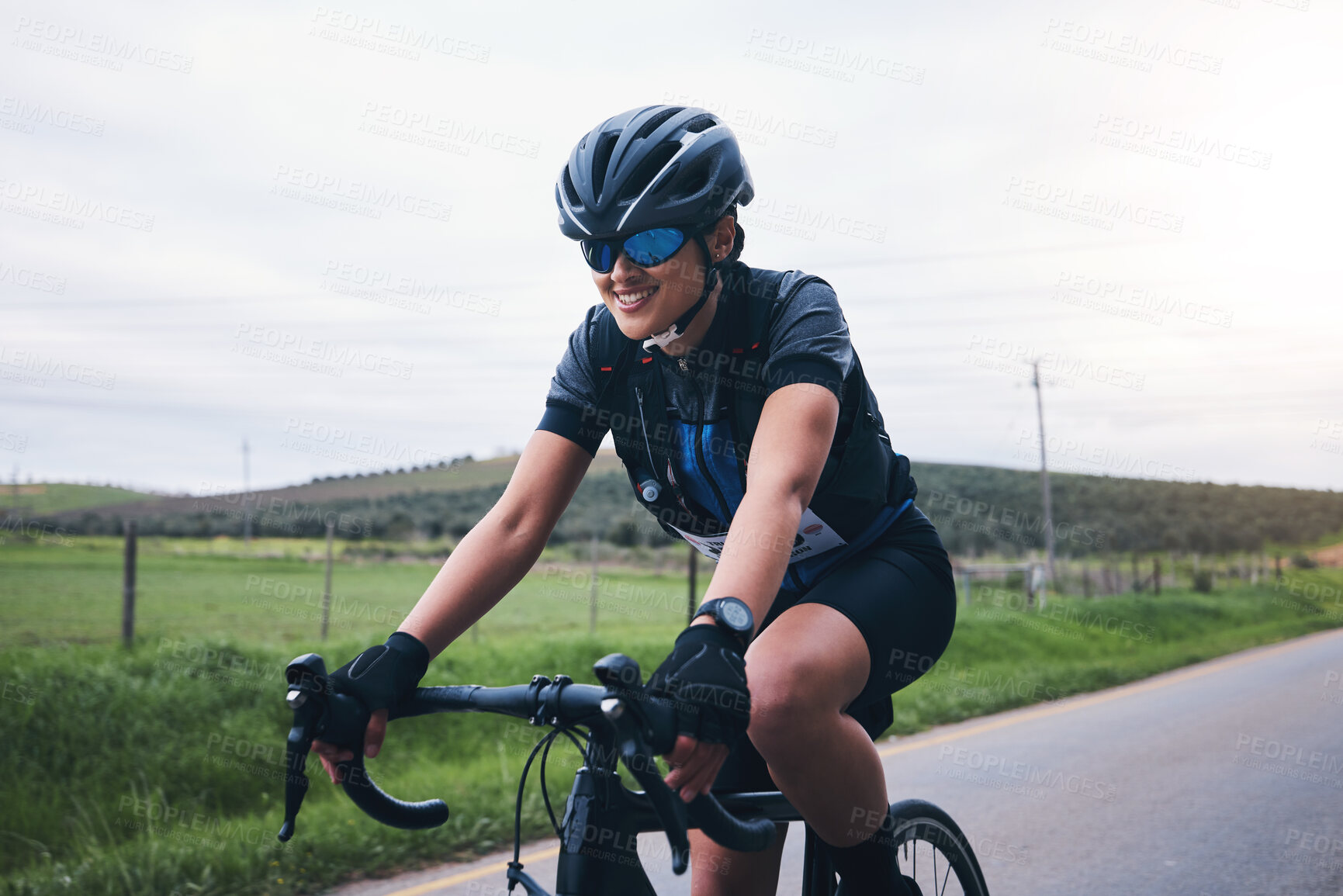 Buy stock photo Sports, nature and female athlete cycling on a bicycle training for a race, marathon or competition. Fitness, workout and woman cyclist riding bike for cardio exercise on outdoor road in the mountain