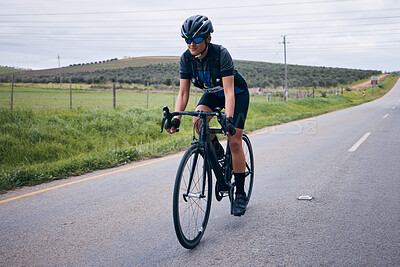 Buy stock photo Fitness, cycling and man on a bicycle in nature training for a race, marathon or competition. Sports, workout and male athlete cyclist riding a bike for cardio exercise on a road in the mountain.