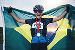 Winner sports, happy woman from brazil with flag and gold medal winning athlete, outdoor cycling race or triathlon. Happiness, win and cyclist with smile, fitness and world record with national pride