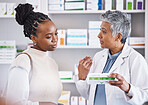Doctor, consulting and patient for healthcare medication, prescription or diagnosis for cure, illness or pain at pharmacy. Woman medical pharmacist talking to customer about pills or drugs at clinic