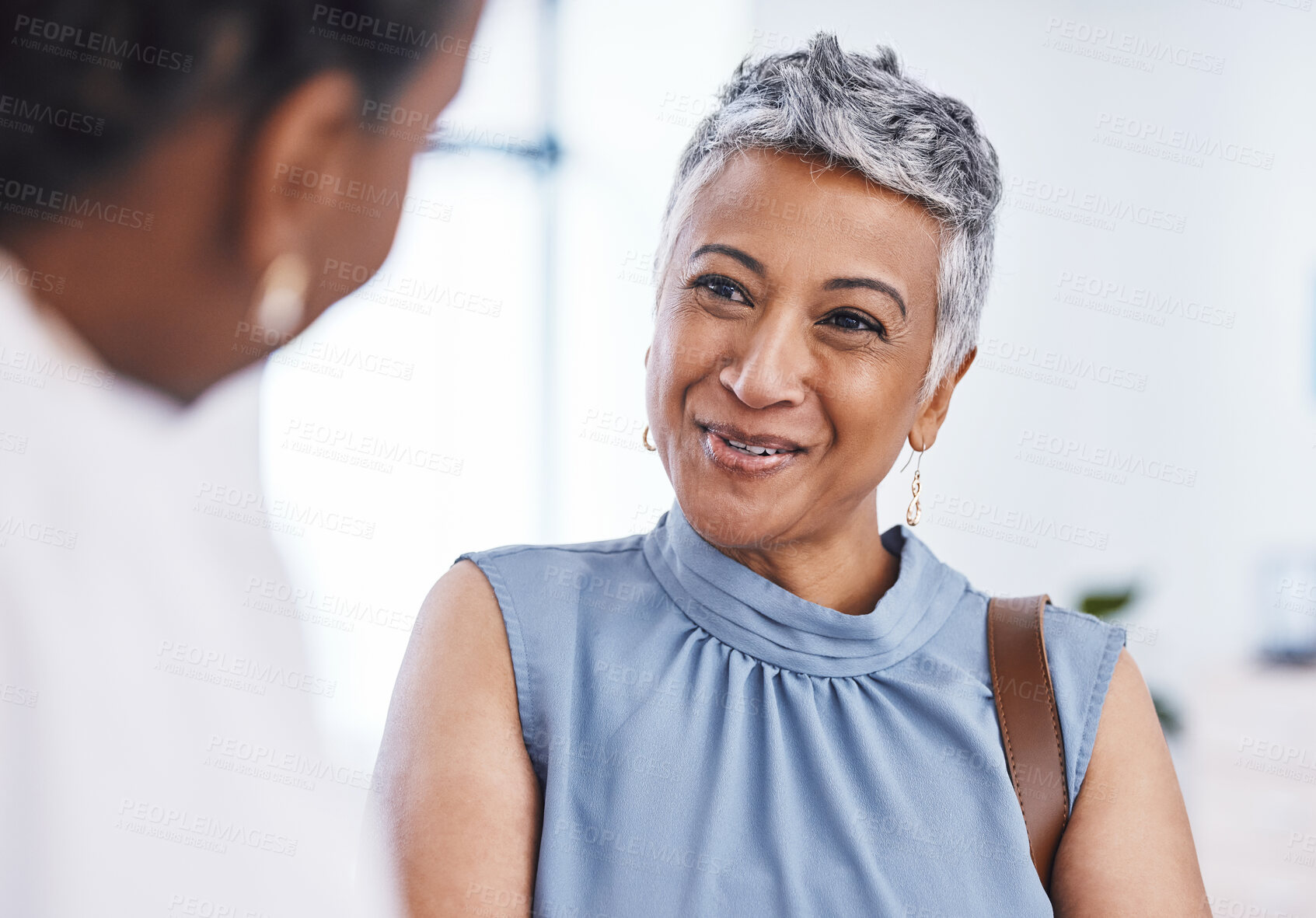Buy stock photo Happy, healthcare and a woman customer in a pharmacy for medicine, talking to a professional consultant. Smile, medical and a mature female patient chatting to a pharmacist in a clinic or dispensary