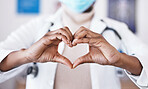 Doctor, hands and heart sign for healthcare or love and care for career as medical worker in hospital. Hand gesture of woman to show support, hope or emoji for charity, cardiology or health insurance