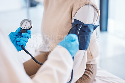 Buy stock photo Hands, doctor and patient with blood pressure test and healthcare advice at clinic. Woman consulting medical professional, health care check and insurance, info and help with wellness at hospital.