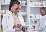 Black woman, doctor and tablet for inventory inspection at pharmacy for healthcare, medication or prescription stock. African female medical expert checking data or research on technology at clinic