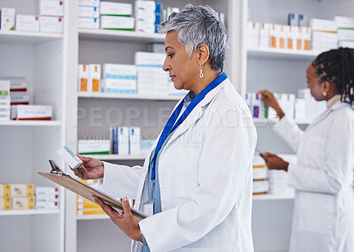 Buy stock photo Woman, doctor and inventory inspection at pharmacy for healthcare, medication or prescription stock. Female medical expert checking and reading pharmaceutical products, pills or drugs at the clinic