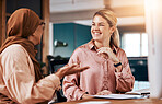 Diversity, Islamic and business women talking or in conversation together planning in a company office. Happy, employees and friends relax and talk or Muslim colleague in discussion on a break 
