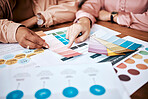 Creative business people, hands and color palette in planning, brainstorming or team strategy on office desk. Hand of graphic designers in teamwork, collaboration and pointing to swatches for design