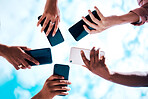 Connection, below and hands with phone on a blue sky for social network, communication and sharing. Bluetooth, friends and group with mobile for an app share, cloud computing and circle networking