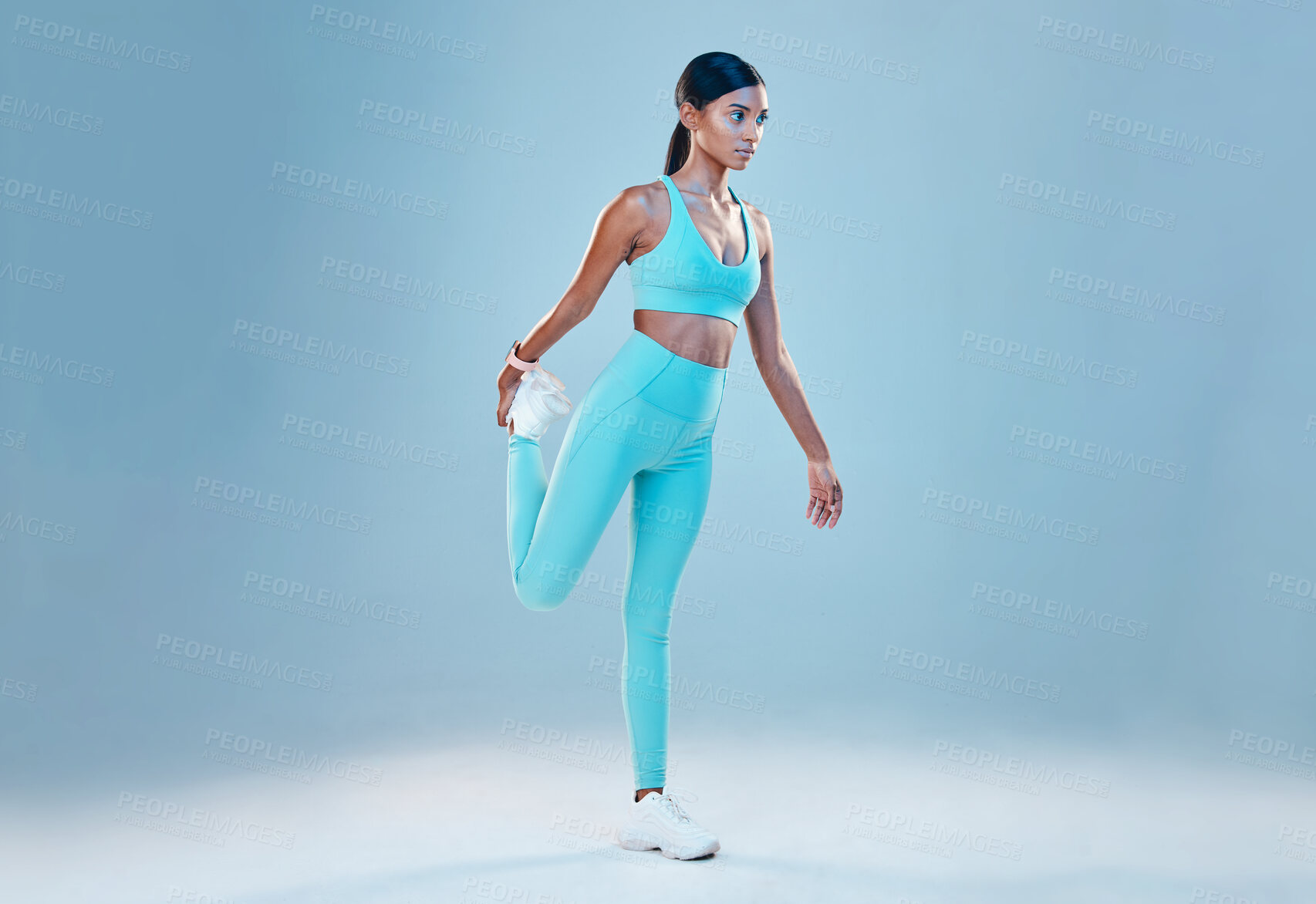 Buy stock photo Fitness, stretching legs and mockup with a woman in studio on a gray background for health or sports. Exercise, warm up and space with a female athlete training for a healthy body or lifestyle