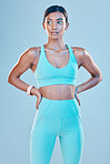Thinking, body and a woman for fitness in gymwear isolated on a studio background for exercise. Idea, sports and an Indian girl standing in workout clothing for training or a cardio idea for health