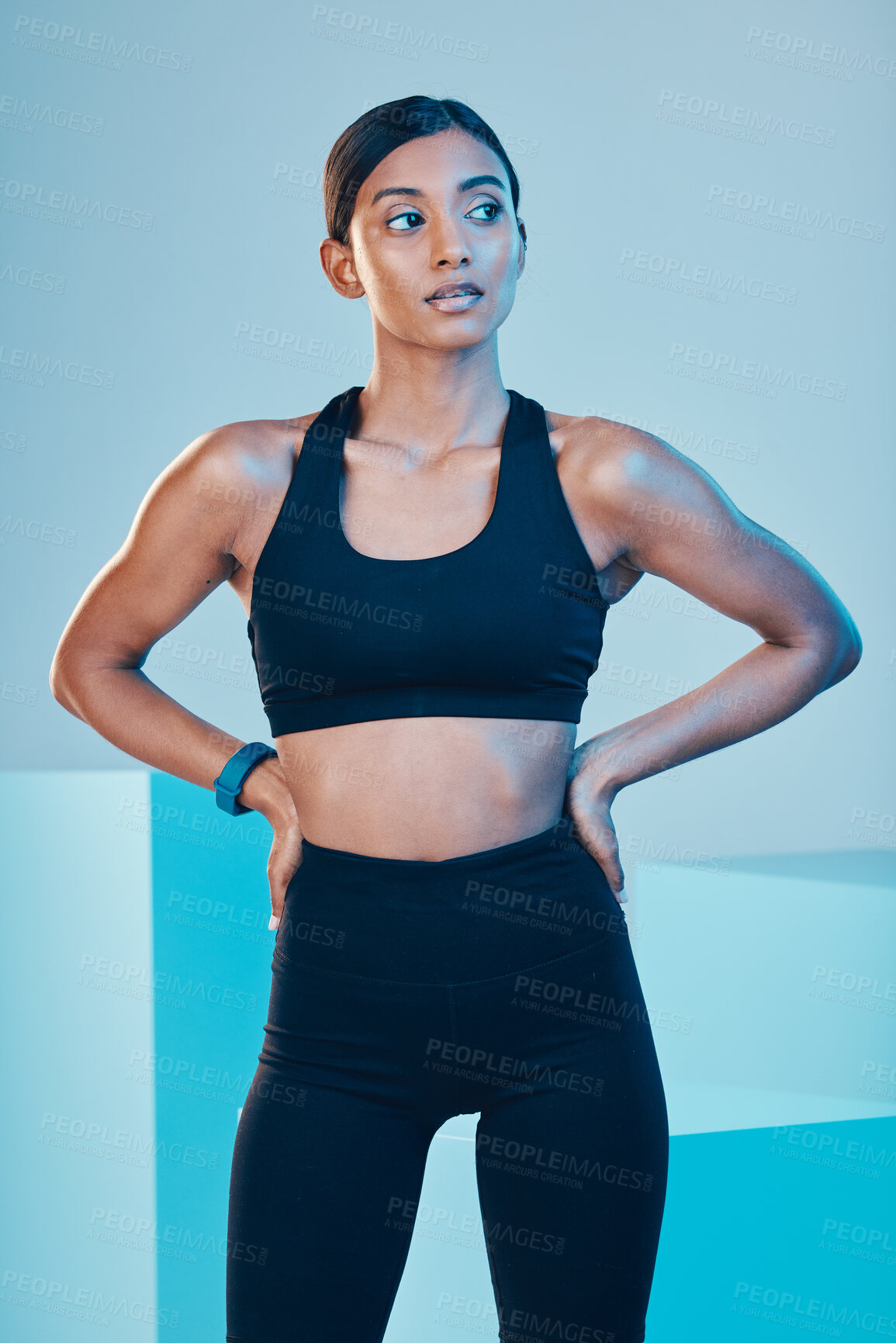 Buy stock photo Thinking, fitness and woman with confidence, sports and training for balance, healthy lifestyle and goals on a blue studio background. Female person, girl and athlete with power, serious and workout
