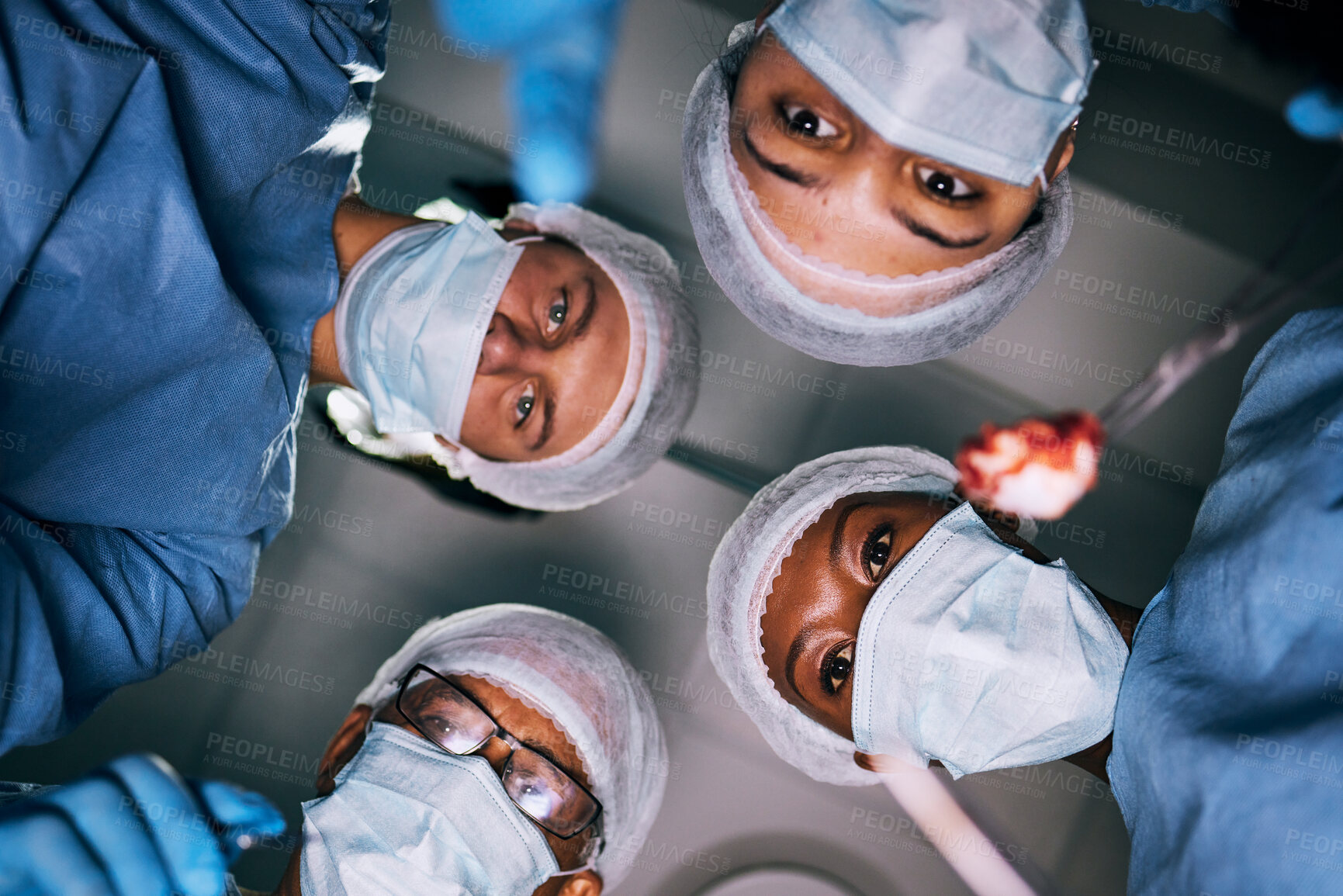 Buy stock photo Pov, surgery or doctors with mask, healthcare or treatment for injury, emergency or teamwork. Portrait, medical professional or staff with face cover, surgical or bottom view of coworkers in hospital