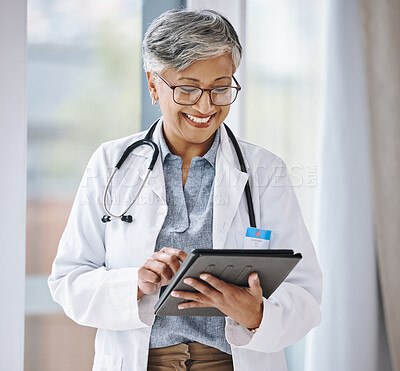 Senior doctor, woman with tablet and digital medical results with hospital schedule and healthcare information online. Happy female physician, health insurance and professional in medicine with tech