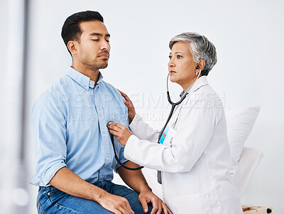 Buy stock photo Patient, doctor and stethoscope for cardiology consultation and to breathe for lungs and heart health. Man and medical professional woman listen to heartbeat for healthcare and wellness check