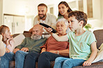 Grandparents, family tv and children in a home living room streaming a web series together. Senior people, kids and television remote watching a video on a lounge couch with a child film and movie