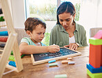 Child, mother and chalkboard writing for math, numbers and home development with happy family, help and support. Biracial woman or mom and kindergarten kid with learning, teaching and education