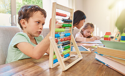 Buy stock photo Education, maths and a boy counting on an abacus while learning in the living room of his home. Children, homework and study with a male school kid in his house for growth or child development