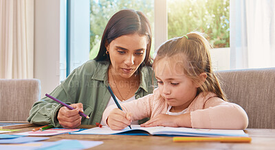 Buy stock photo Education, mother and girl with homework, writing and lesson at home, focus and learning. Family, parents and mama with female child, daughter and happy kid with notes, fun or growth with development