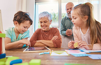 Buy stock photo Family, home school and tablet, grandparents and children at table learning online with technology app. Education, happiness or old woman, man and kids with elearning for growth and child development